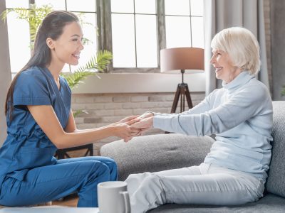 assisting-senior-people-female-caregiver-holding-2022-05-31-02-21-32-utc.jpg