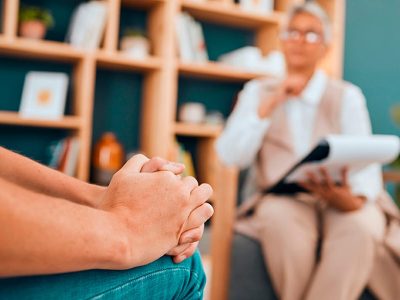 Cropped shot of a nurse holding an elderly womans hands.