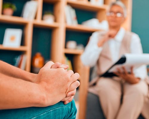 Cropped shot of a nurse holding an elderly womans hands.